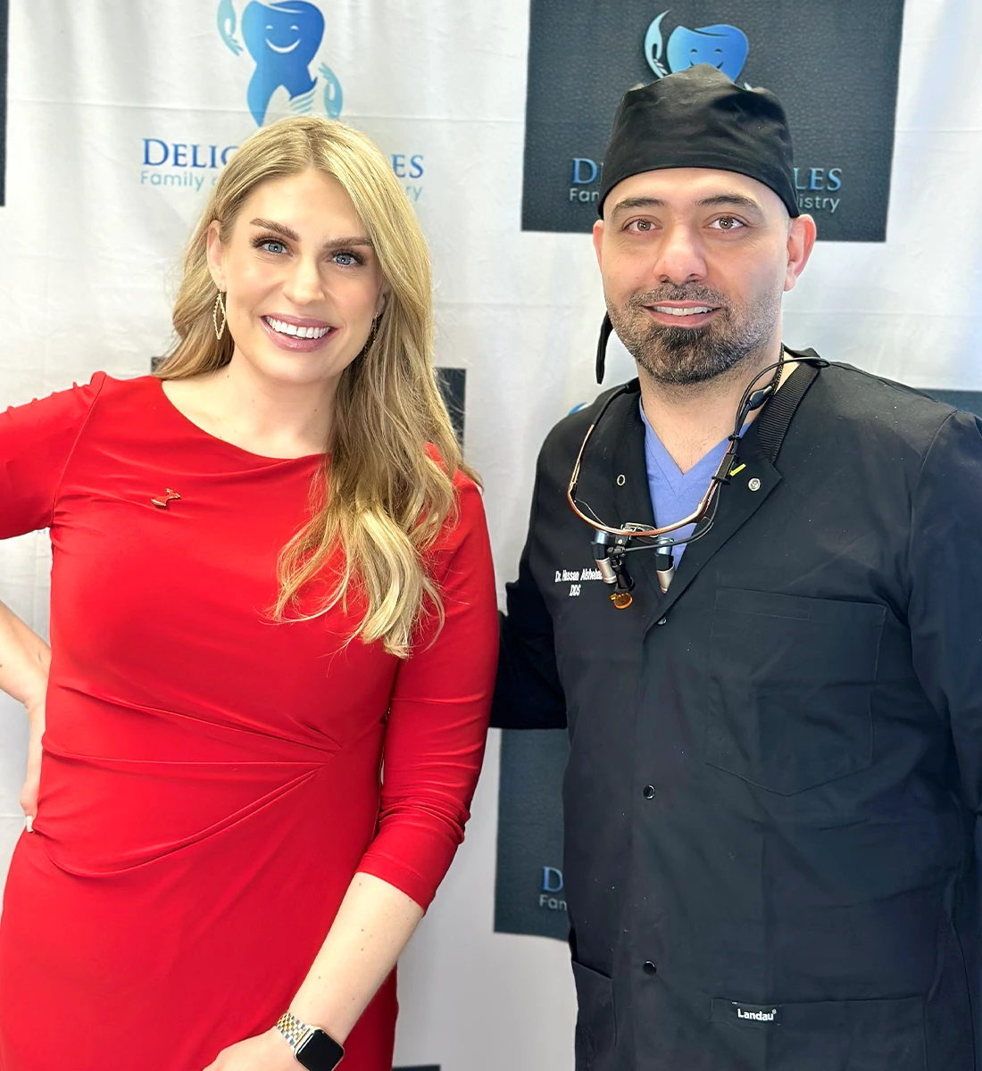 Delicate smiles milwaukee cosmetic dentist with patient red dress