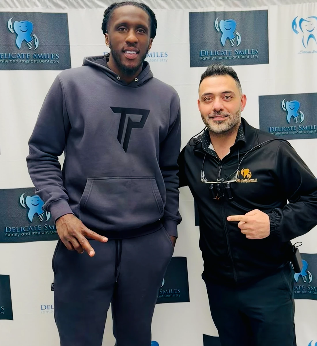 Delicate smiles milwaukee dentist with basketball player 2