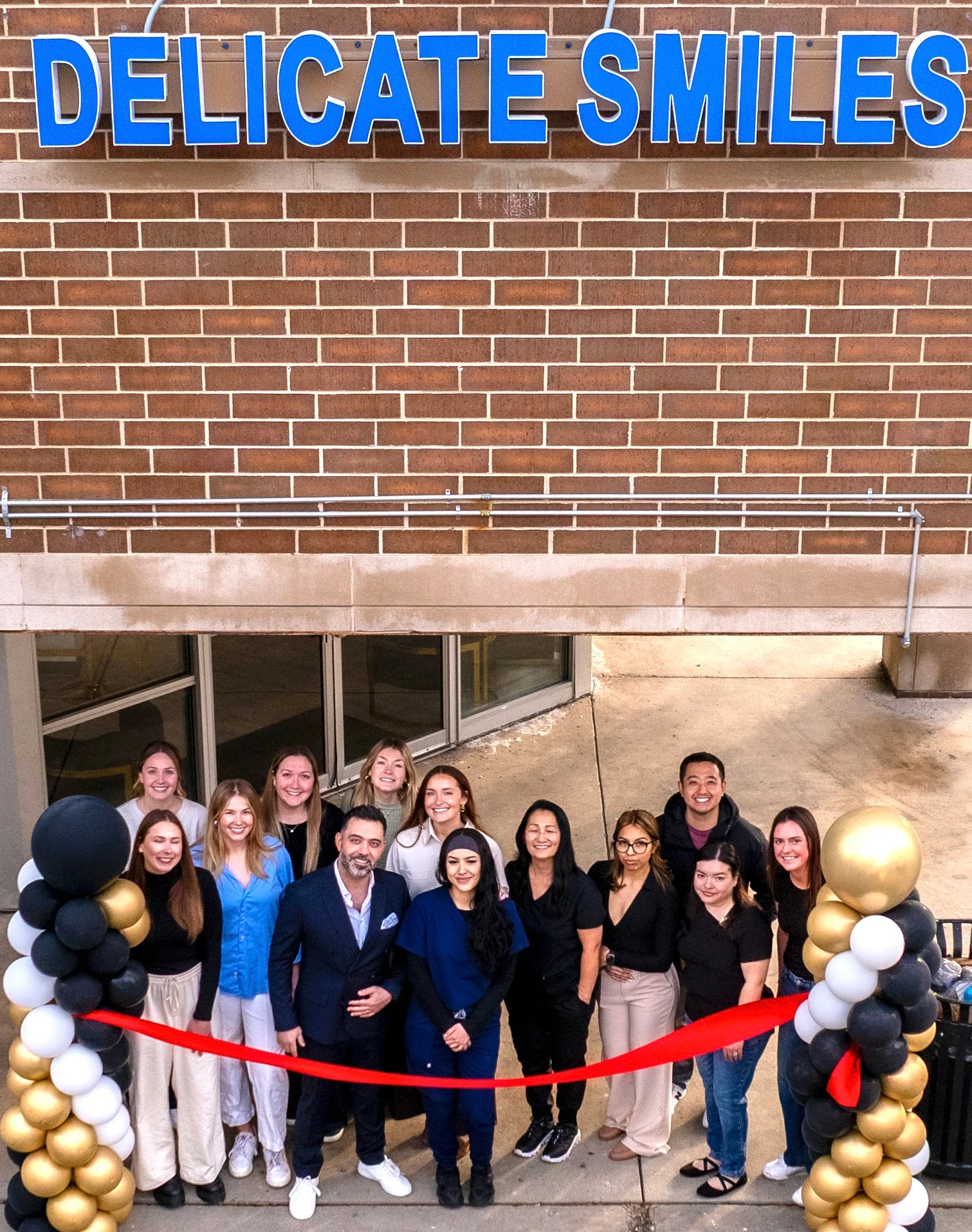 Delicate smiles milwaukee grand opening ribbon cutting team